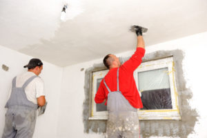 Handyman repairing stucco repairs