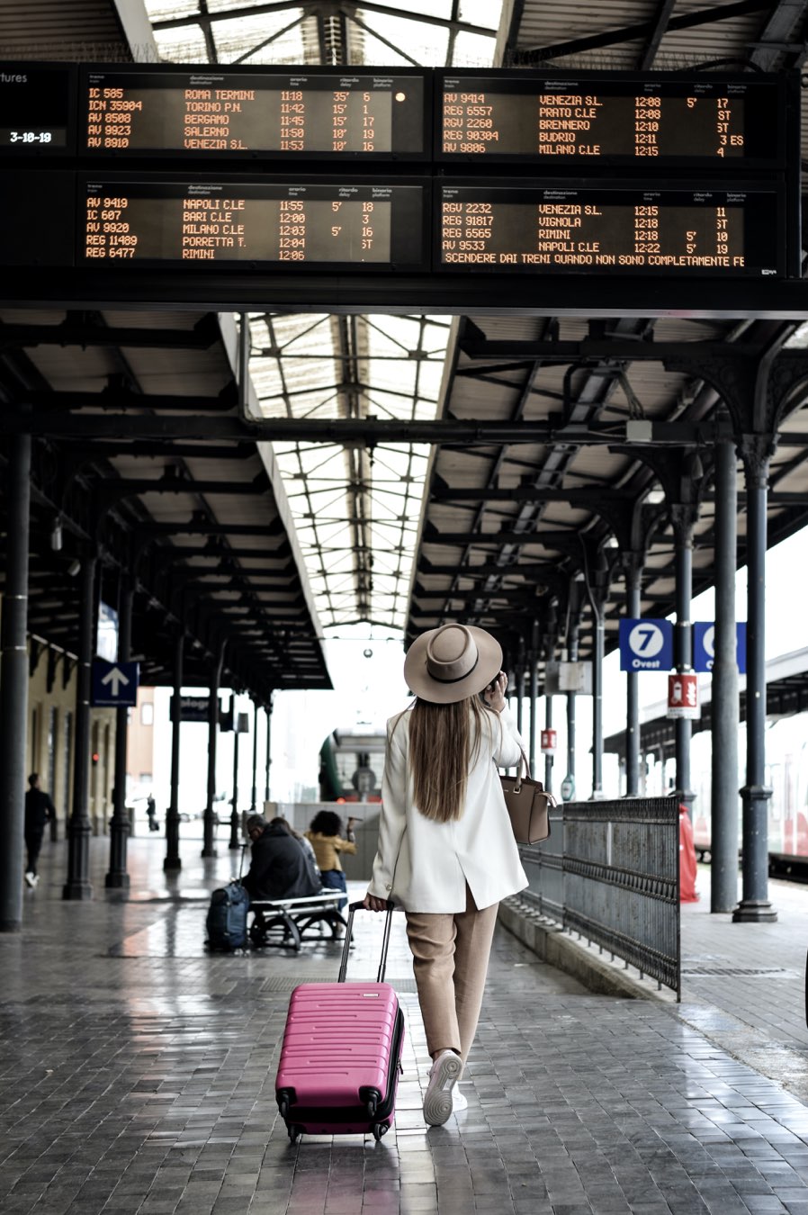 woman walking in a terminal