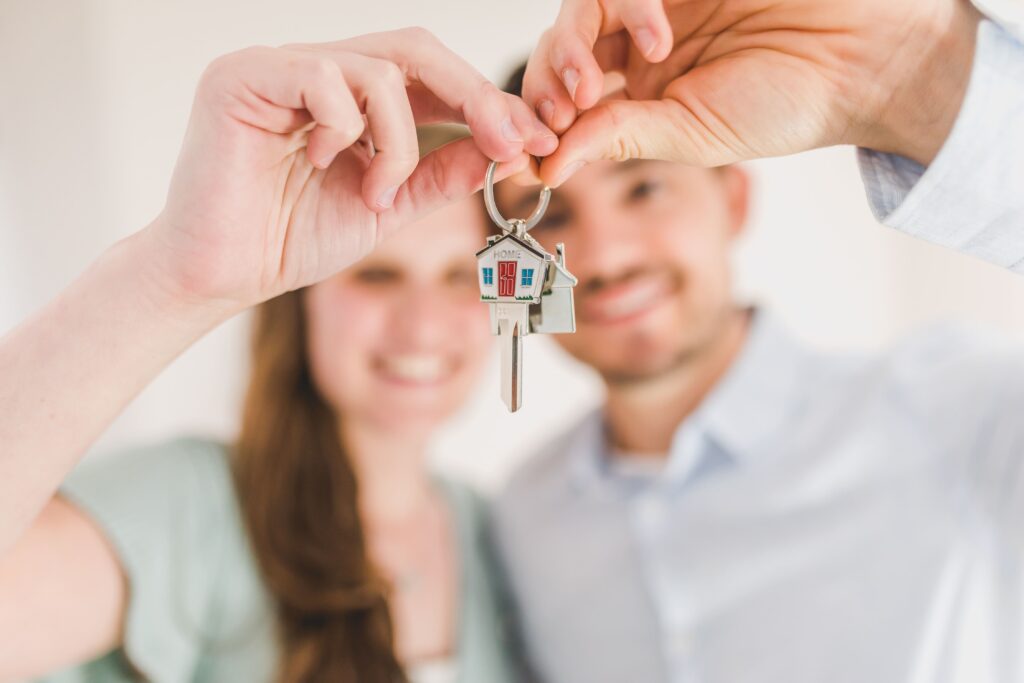 Happy Couple Hold and Showing a House Key