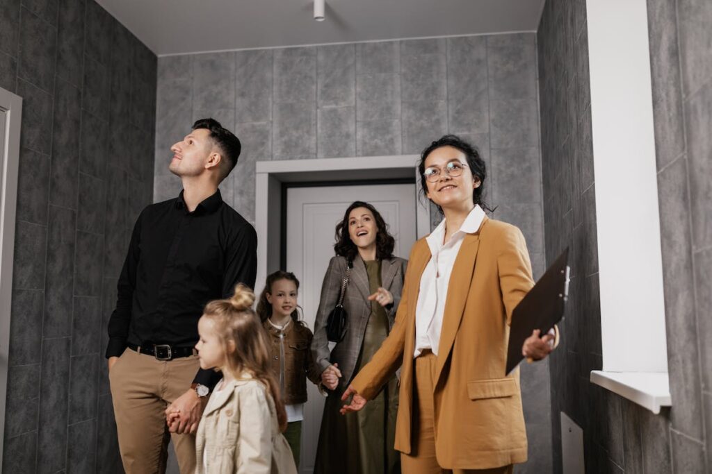 Real Estate Agent Showing House to Family