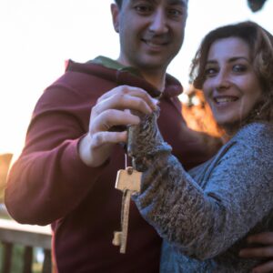 a couple holding the keys to their new home