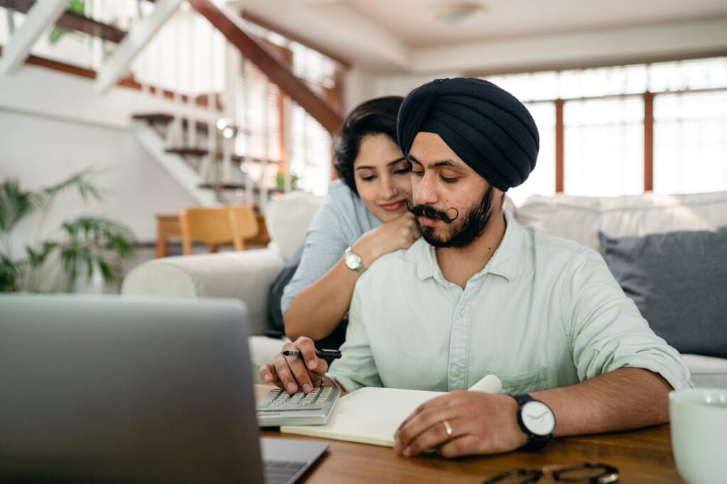 Fed Tax Return - Indian Couple Checking Their Finances