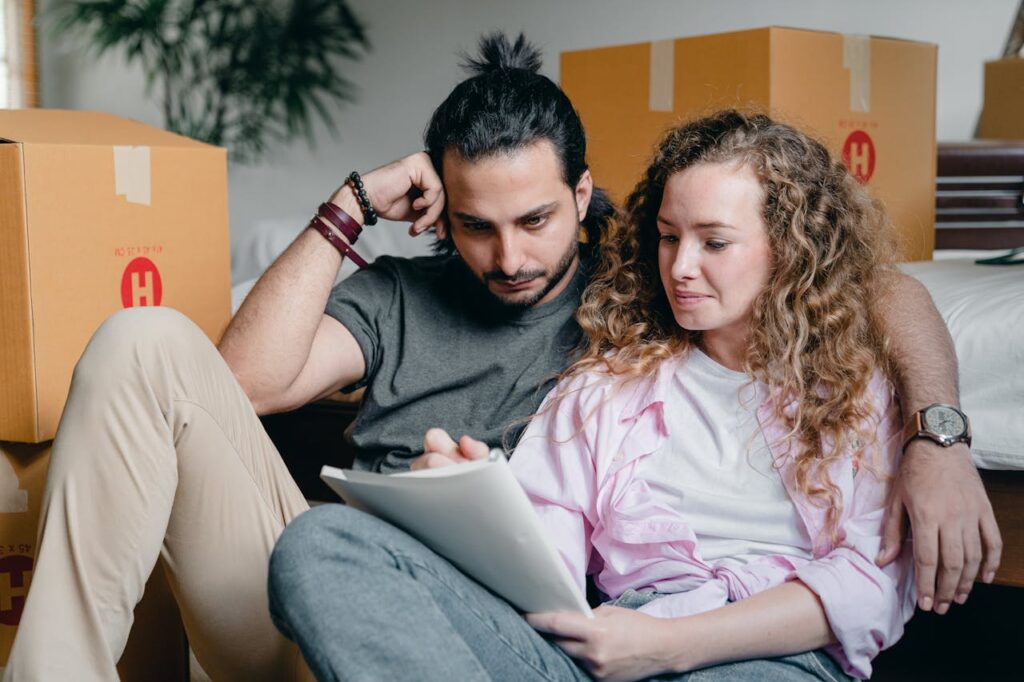 A Couple Writing in a Notebook