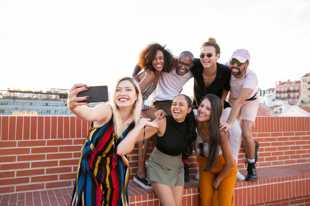 An Excited and Happy Group taking a Selfie on a Rooftop