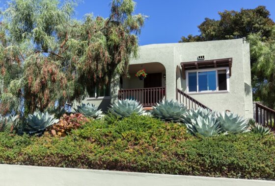 View of Spanish Style home featuring low maintenance landscape