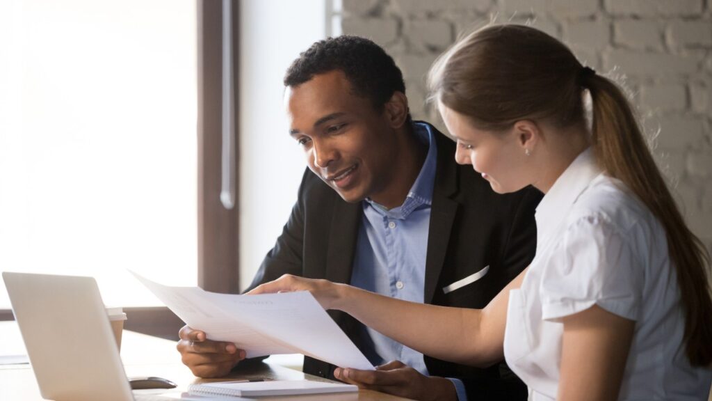 An Insurance Agent and Client Talking About Policies