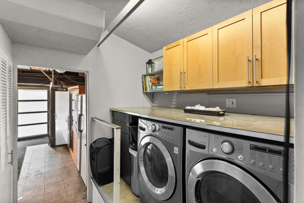 stainless steel washer and dryer with maple color cabinets