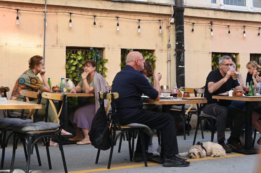 Cozy Outdoor Cafe Scene with People Dining
