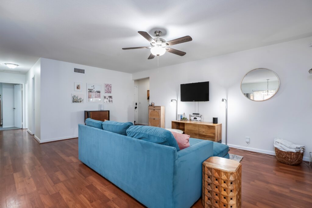 Open-concept living area at 2170 Montclair St in North Park, showing the transition from the lounge to the hallway and dining space.