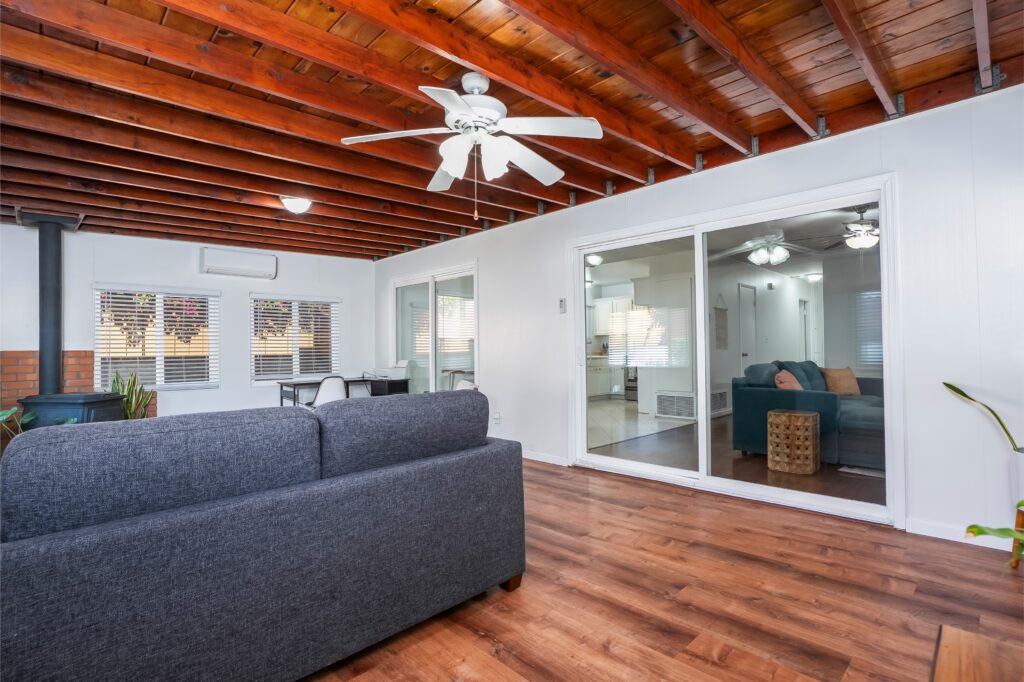 Sun-filled bonus room at 2170 Montclair St North Park with exposed Knotty Pine ceilings