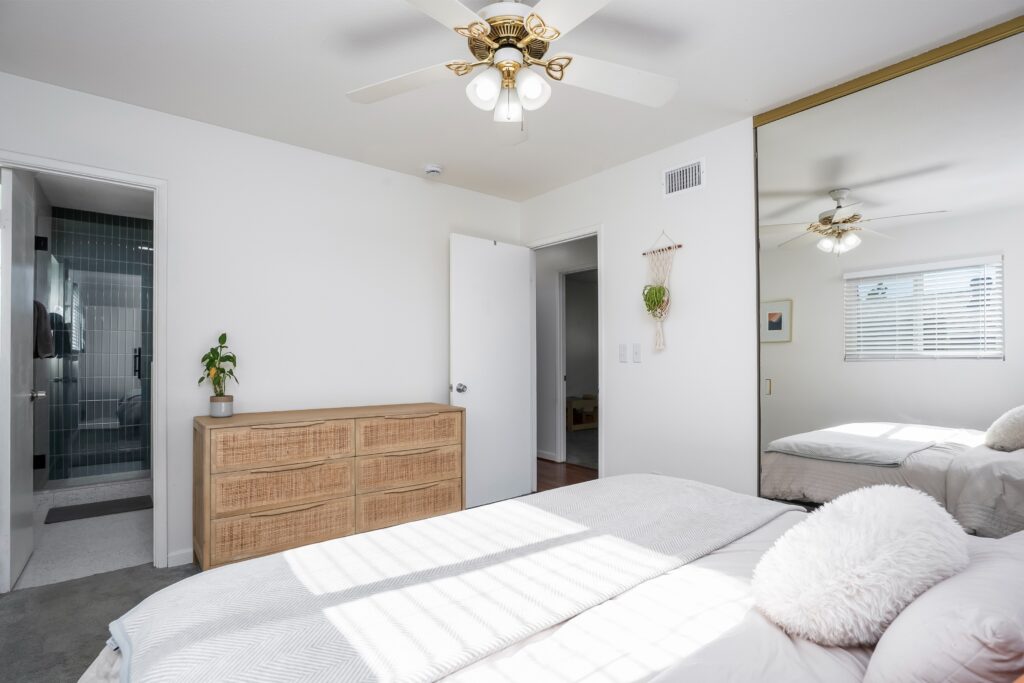 Spacious primary suite at 2170 Montclair St in North Park San Diego with views into the attached newly remodeled bathroom.