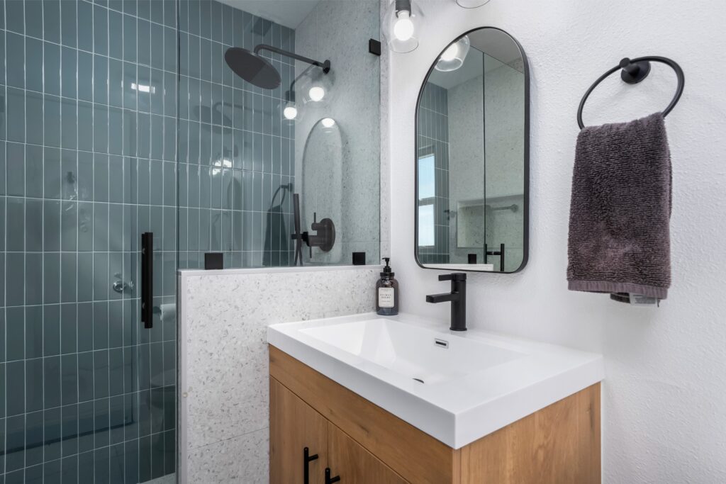 Detail view of a modern white sink and matte black faucet at 2170 Montclair St, showing the high-end finishes in this North Park