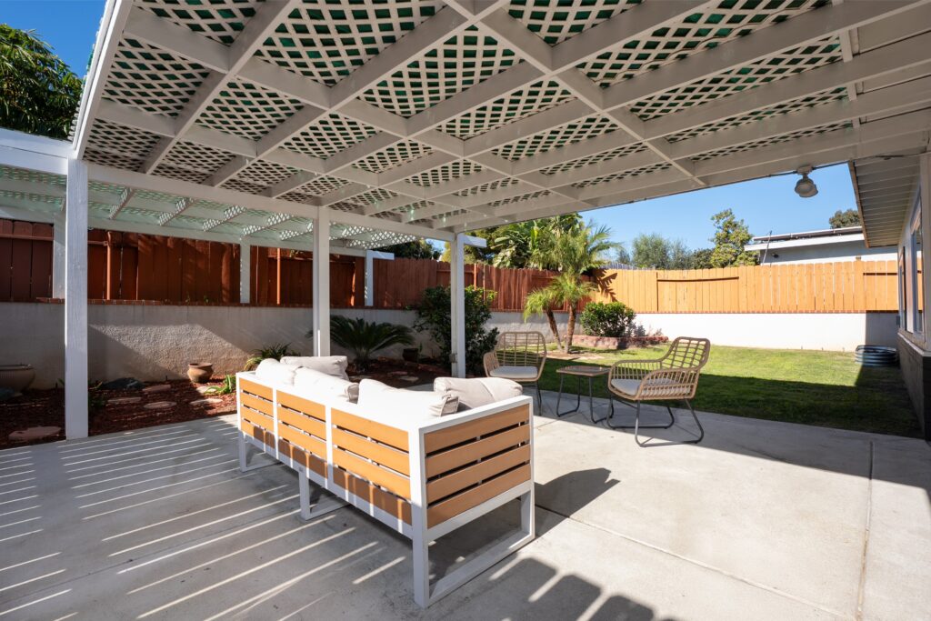 Architecturally designed outdoor living space at 2170 Montclair St, displaying a weather-protected pergola and drought-tolerant landscaping in a quiet North Park pocket.