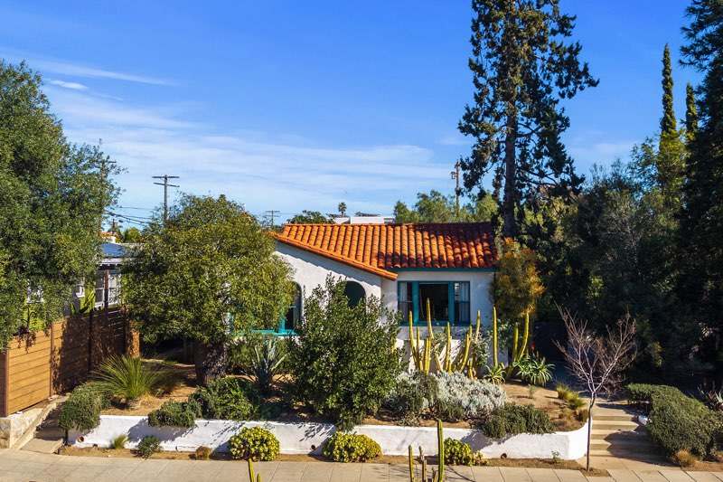 Spanish Revival Home in North Park San Diego Spanish Revival home on oversized lot in North Park, San Diego, featuring mature landscaping and classic architectural charm.