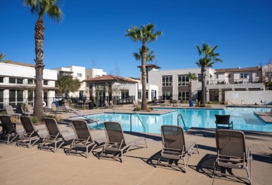 Wide-angle view of the resort-style pool and spa area at the Playa Del Sol recreation center